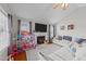 Bright living room featuring a fireplace, vaulted ceilings, and cozy decor at 23 Sparkle Ln, Garner, NC 27529