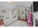 Bright living room with a fireplace, vaulted ceilings, and hardwood floors at 23 Sparkle Ln, Garner, NC 27529