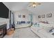 Bright living room featuring a fireplace, vaulted ceilings, and hardwood floors at 23 Sparkle Ln, Garner, NC 27529