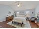 Spacious main bedroom with vaulted ceiling, ceiling fan, and wood-look flooring at 23 Sparkle Ln, Garner, NC 27529