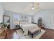 Bright main bedroom featuring vaulted ceiling, geometric rug, and seating bench at 23 Sparkle Ln, Garner, NC 27529