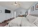 Open main bedroom featuring a tv, with vaulted ceiling and ensuite bathroom at 23 Sparkle Ln, Garner, NC 27529