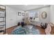 Home office featuring large desk, double doors and natural light at 23 Sparkle Ln, Garner, NC 27529
