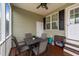 Cozy screened porch with ceiling fan and outdoor dining set at 23 Sparkle Ln, Garner, NC 27529