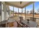 Screened porch with outdoor seating and views of the large backyard at 23 Sparkle Ln, Garner, NC 27529