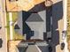 Aerial view of a newly constructed home with a dark roof, showcasing its backyard at 2623 Marchmont St, Raleigh, NC 27608