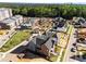 Aerial view of houses being built in a planned community with green spaces and modern design at 2623 Marchmont St, Raleigh, NC 27608