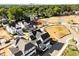 Aerial view showcasing new construction homes, a skyline, and landscaping, offering modern community living at 2623 Marchmont St, Raleigh, NC 27608