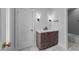 Bathroom boasts a quartz countertop, stylish fixtures, and tiled floors with a modern design at 2623 Marchmont St, Raleigh, NC 27608