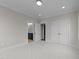 Clean bedroom featuring large double door closet and entry to the bathroom, showcasing modern design at 2623 Marchmont St, Raleigh, NC 27608