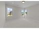 Bright bedroom featuring neutral walls, carpet and multiple windows providing abundant natural light at 2623 Marchmont St, Raleigh, NC 27608