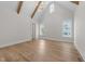 Large room with exposed beams and bright lighting at 2623 Marchmont St, Raleigh, NC 27608