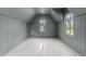 Unfurnished attic bedroom featuring neutral paint and trim and two windows with views at 2623 Marchmont St, Raleigh, NC 27608