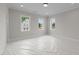 Bright bedroom with three windows providing natural light, showcasing construction details, and modern design at 2623 Marchmont St, Raleigh, NC 27608