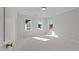 Bright bedroom with neutral carpet, natural light from multiple windows, and recessed lighting at 2623 Marchmont St, Raleigh, NC 27608