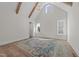 Large, open bedroom with vaulted ceiling, wood beams, and ample natural light at 2623 Marchmont St, Raleigh, NC 27608