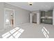 Cozy bonus room with wet bar, soft carpet, recessed lights, and an open doorway to the bathroom at 2623 Marchmont St, Raleigh, NC 27608