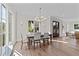 Sunlit dining room featuring an elegant chandelier and ample seating for Gathering and friends at 2623 Marchmont St, Raleigh, NC 27608