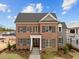 Beautiful two-story home featuring a classic brick facade, elegant front door, and manicured front lawn at 2623 Marchmont St, Raleigh, NC 27608