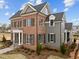 Beautiful home featuring brick and siding, complemented by lush landscaping at 2623 Marchmont St, Raleigh, NC 27608