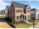 Beautiful brick home with dark shutters, manicured landscaping, and a welcoming front entrance at 2623 Marchmont St, Raleigh, NC 27608