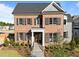 Charming brick home with black shutters, manicured landscaping, and welcoming front entrance at 2623 Marchmont St, Raleigh, NC 27608