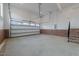Bright and spacious garage features red brick foundation, large garage door and stairs to upper level at 2623 Marchmont St, Raleigh, NC 27608