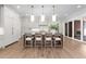 Bright, spacious kitchen featuring an island with barstool seating and modern light fixtures at 2623 Marchmont St, Raleigh, NC 27608