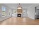 Inviting living area with a modern fireplace and built-in cabinets, perfect for gatherings at 2623 Marchmont St, Raleigh, NC 27608