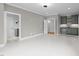 Unfurnished living room with wet bar, blue-gray cabinets and beverage center; neutral paint and trim at 2623 Marchmont St, Raleigh, NC 27608