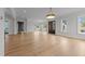 Spacious open-concept living area with hardwood floors and abundant natural light at 2623 Marchmont St, Raleigh, NC 27608