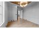 Contemporary office featuring hardwood floors, unique ceiling, and modern light fixture at 2623 Marchmont St, Raleigh, NC 27608