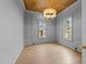 Chic office with hardwood floors, modern lighting, and stylish wall paneling at 2623 Marchmont St, Raleigh, NC 27608
