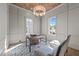 Bright office space with wood-paneled ceiling, custom rug, and natural light from two windows at 2623 Marchmont St, Raleigh, NC 27608