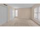 Cozy bedroom with plush carpet, large closet, and ample natural light at 2821 Edridge Ct # 102, Raleigh, NC 27612