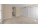 Bedroom featuring soft carpet, dual closets, and fresh paint at 2821 Edridge Ct # 102, Raleigh, NC 27612