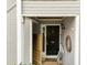 View of front door, framed by gray siding and white trim at 2821 Edridge Ct # 102, Raleigh, NC 27612