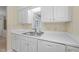 A kitchen featuring white cabinets and appliances and linoleum flooring at 2821 Edridge Ct # 102, Raleigh, NC 27612