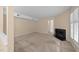 Spacious living room featuring a fireplace, neutral tones, and natural light at 2821 Edridge Ct # 102, Raleigh, NC 27612