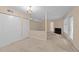 Spacious living room featuring neutral paint, carpet, and large windows at 2821 Edridge Ct # 102, Raleigh, NC 27612