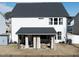 Spacious backyard featuring a covered patio area, perfect for outdoor entertaining and relaxation at 318 Highland Forest Dr, Fuquay Varina, NC 27526