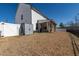 Large backyard showcasing a covered patio, perfect for outdoor dining and enjoying the expansive lawn at 318 Highland Forest Dr, Fuquay Varina, NC 27526