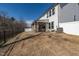 Well-maintained backyard with a covered patio, offering a serene outdoor living space and privacy at 318 Highland Forest Dr, Fuquay Varina, NC 27526