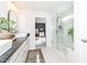 Bright bathroom featuring glass shower, vessel sinks, and modern fixtures at 318 Highland Forest Dr, Fuquay Varina, NC 27526