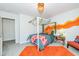 Stylized bedroom features a four poster bed with bright orange accents at 318 Highland Forest Dr, Fuquay Varina, NC 27526