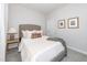 Cozy bedroom with a comfortable bed, neutral colors, and soft carpet at 318 Highland Forest Dr, Fuquay Varina, NC 27526