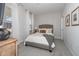 Comfortable bedroom with neutral colors, soft lighting, and carpet flooring at 318 Highland Forest Dr, Fuquay Varina, NC 27526