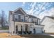 Charming two-story home with a covered front porch, white columns, and a two-car garage at 318 Highland Forest Dr, Fuquay Varina, NC 27526