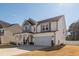 Two story home with a spacious front yard and attached two car garage at 318 Highland Forest Dr, Fuquay Varina, NC 27526
