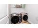 Modern laundry room featuring side-by-side washer and dryer units at 318 Highland Forest Dr, Fuquay Varina, NC 27526